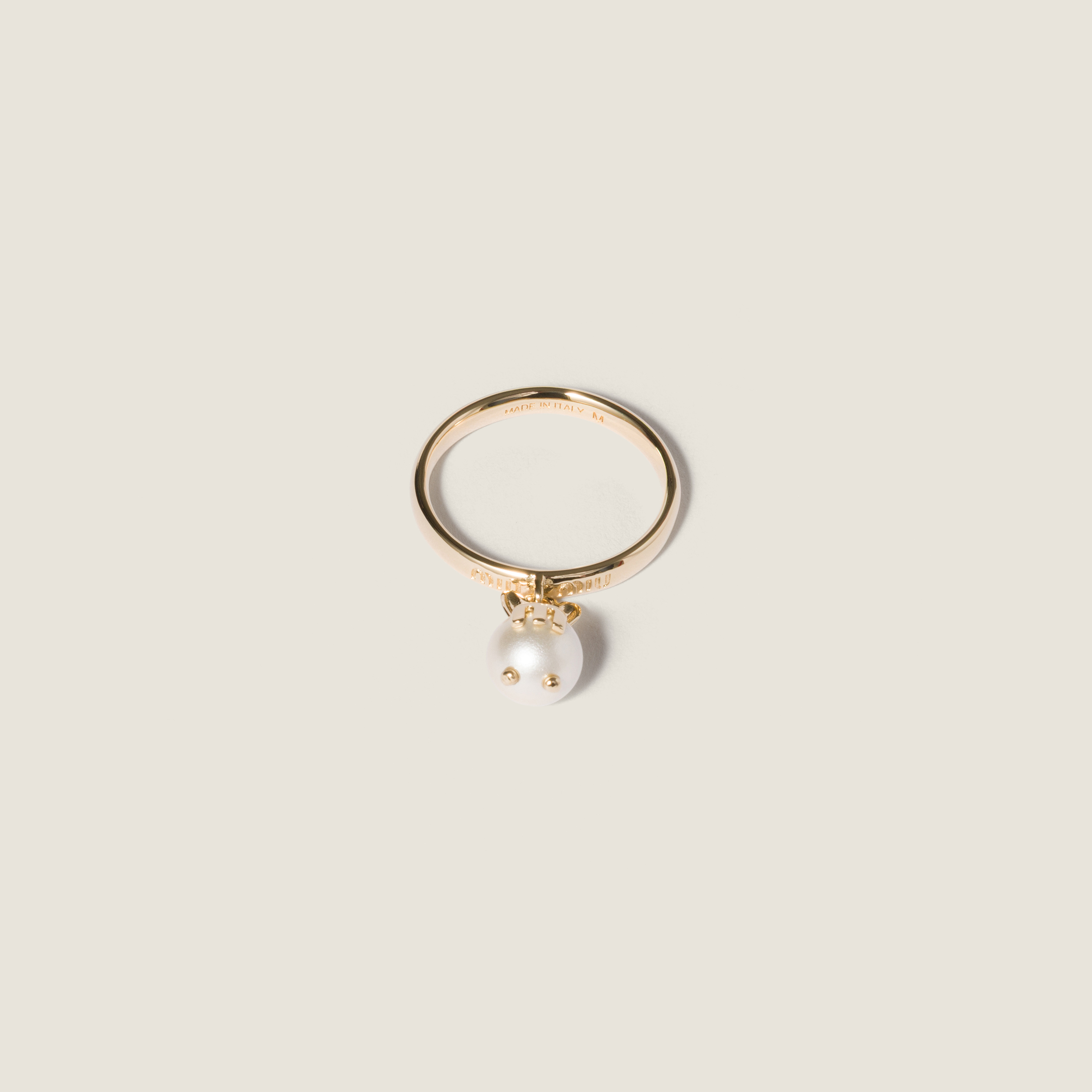 Metal ring with pendant