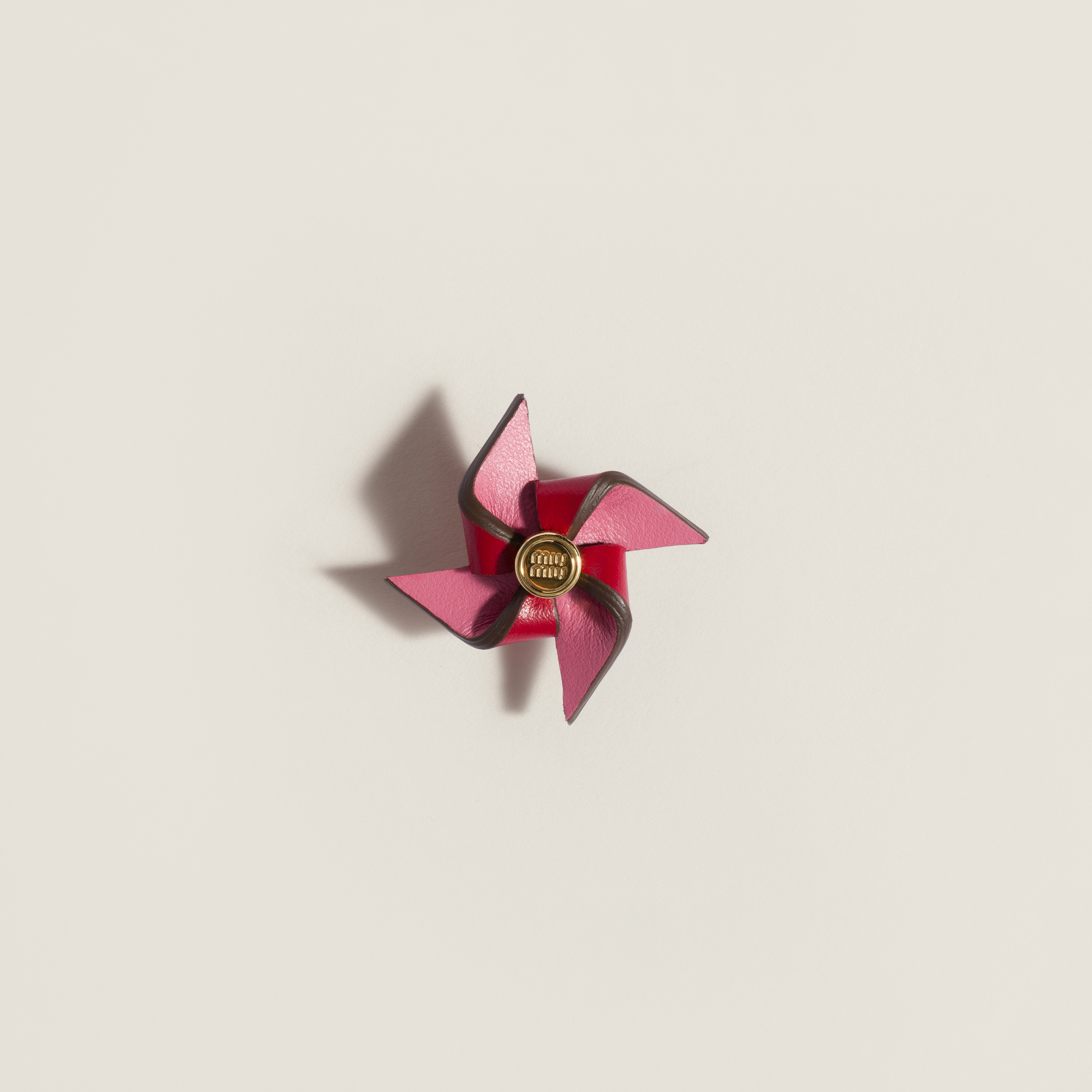 Leather pinwheel brooch