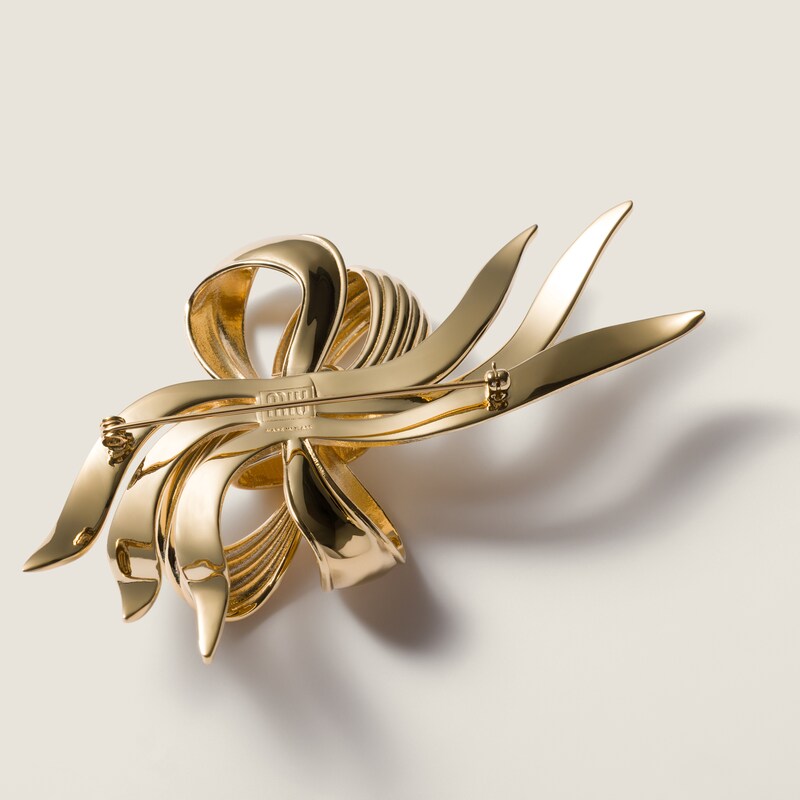 Metal bow brooch